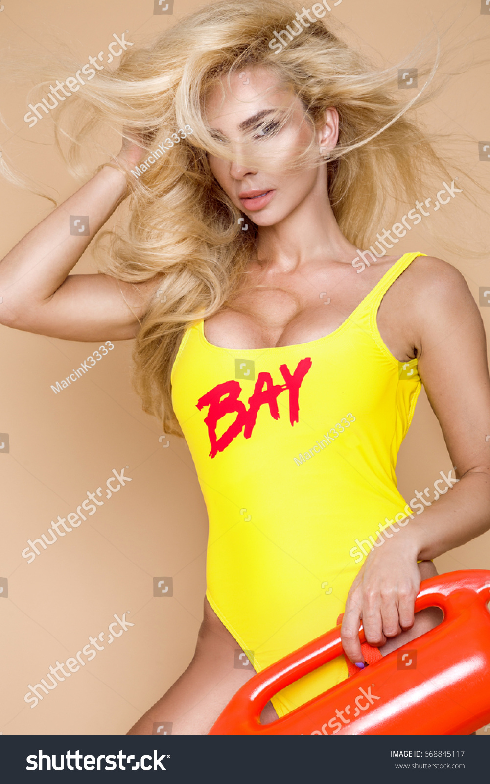 Sexy Busty Lifeguard Woman Bikini Holding Foto De Stock 668845117