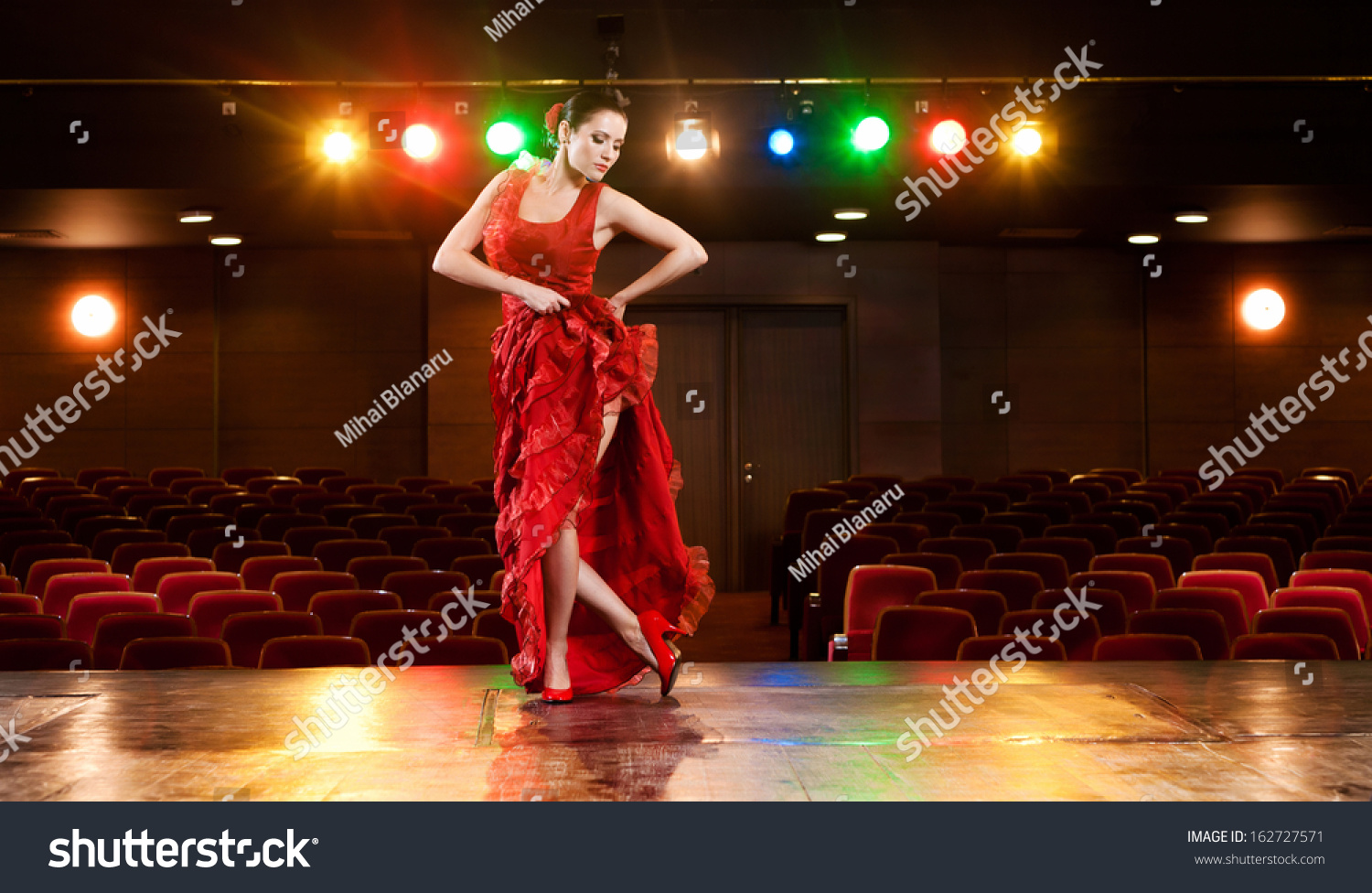 Sexy Flamenco Dancer Performing Her Dance In A Red Long Dress Stock