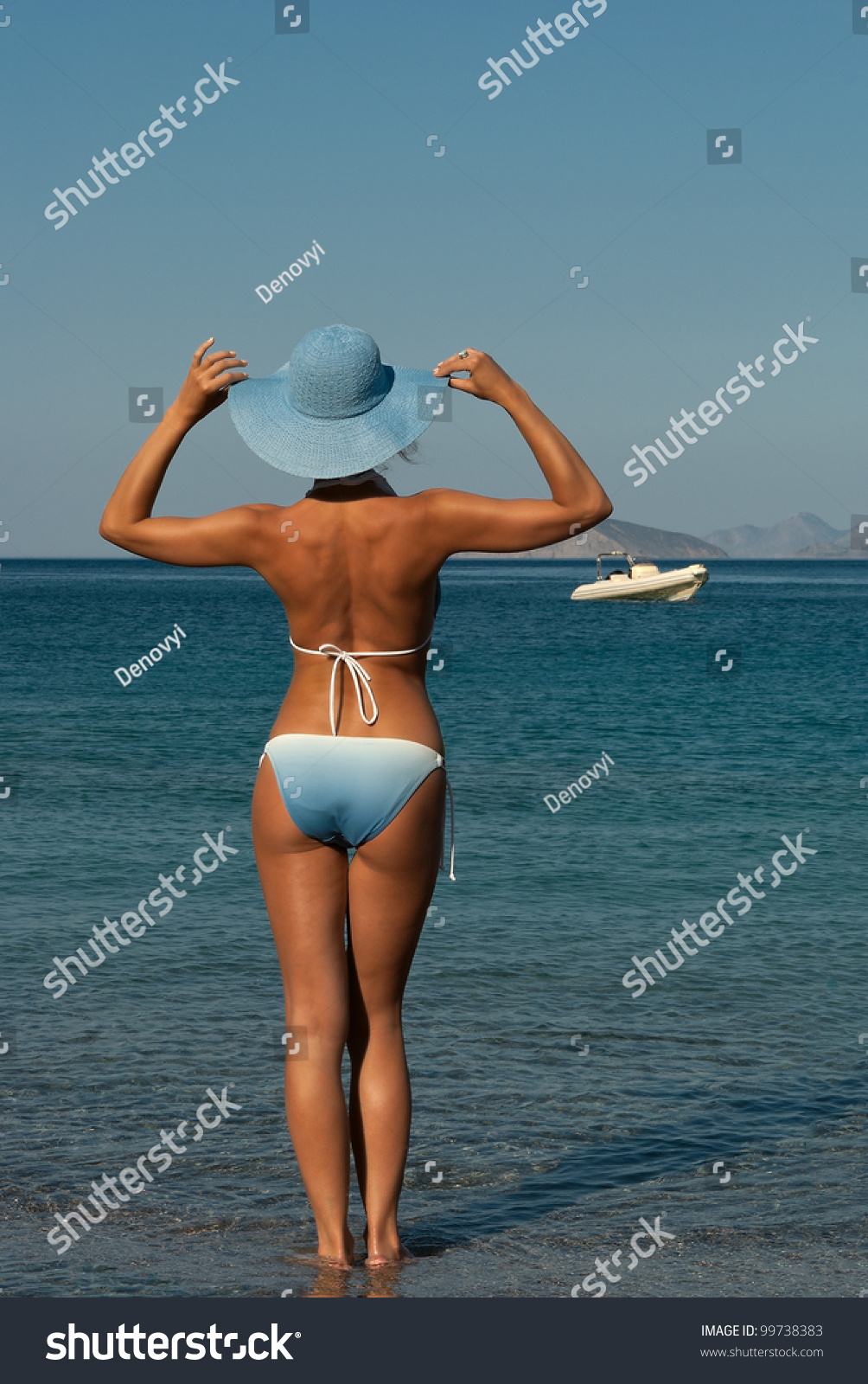 Sexy Woman In Bikini On Mediterranean Beach Looking To Horizon Crete