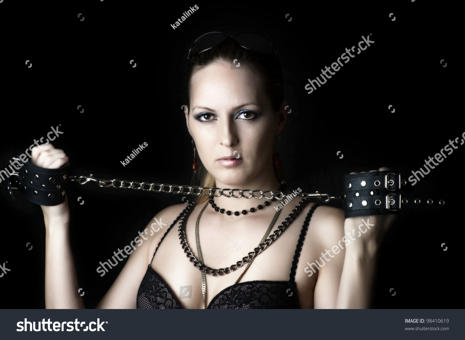 Sexy Woman Lady Or Madam In Bdsm Play With Handcuffs On Black
