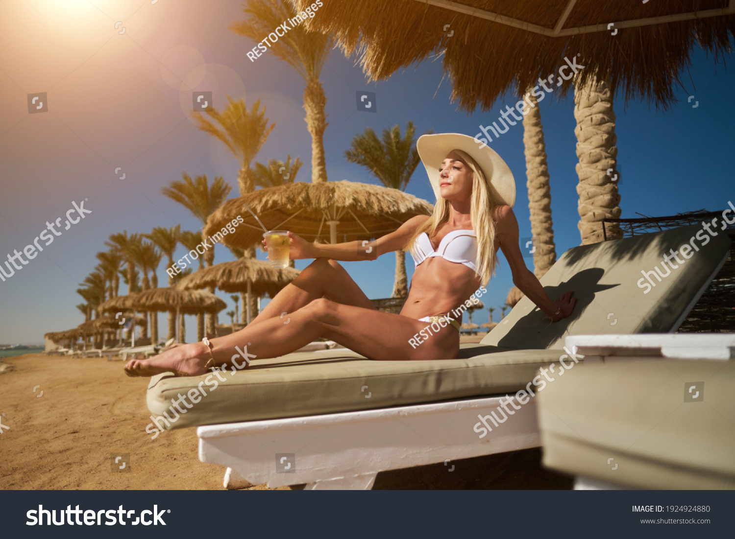 Sexy Woman Wearing Bikini Sitting On Stock Photo Edit Now