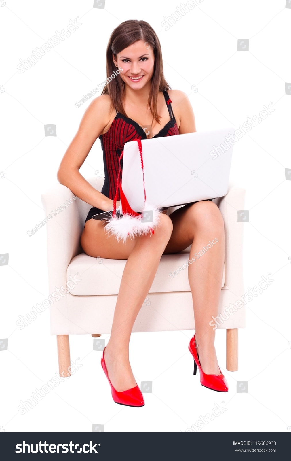 Sexy Woman With Lingerie Sitting In Armchair With Her Laptop Stock