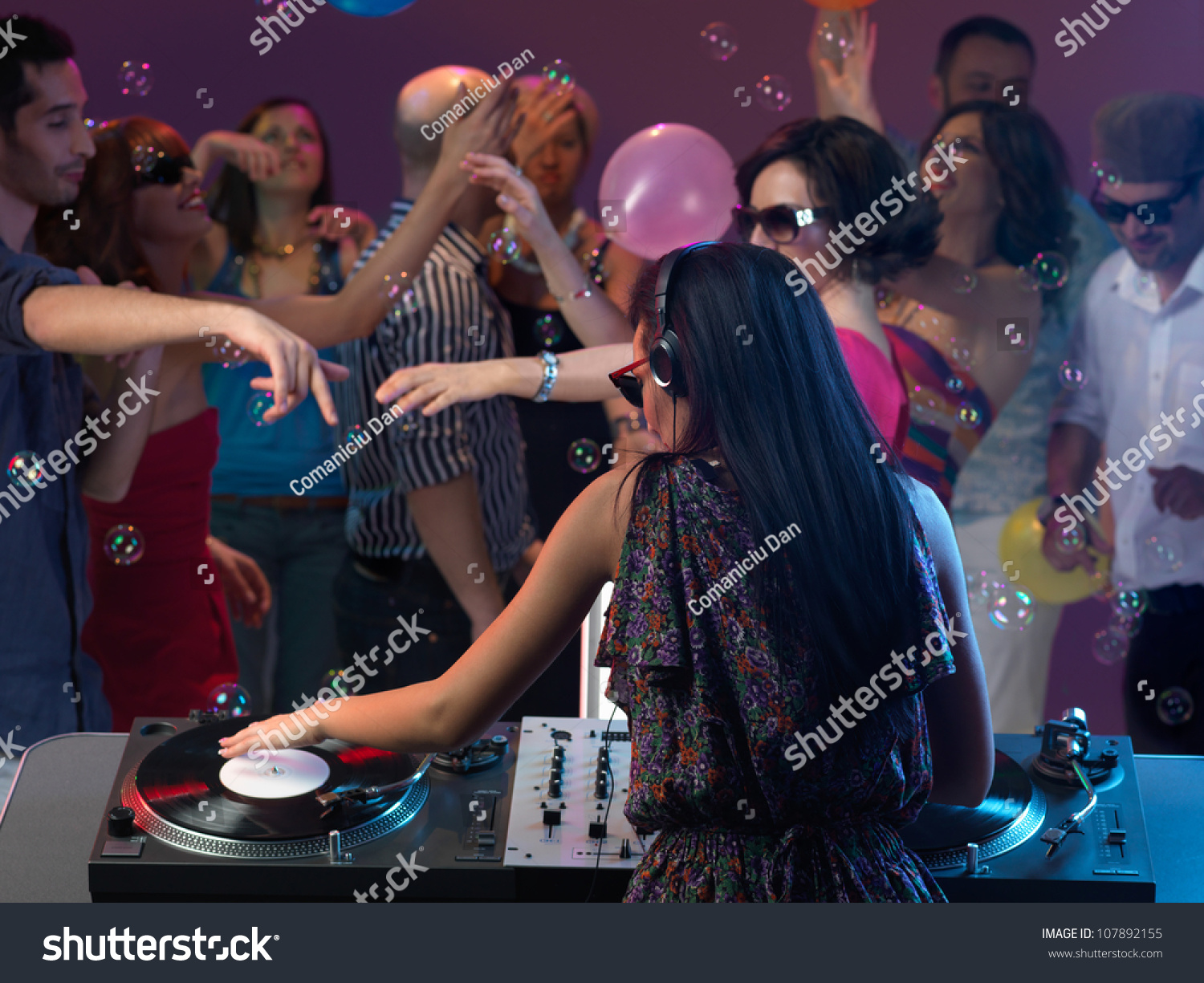 Sexy Young Woman Dj Entertaining The Crowd In A Night Club Stock