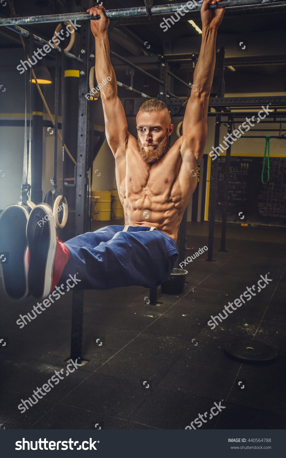 Shirtless Muscular Bearded Male Doing Exercises Stock Photo 440564788