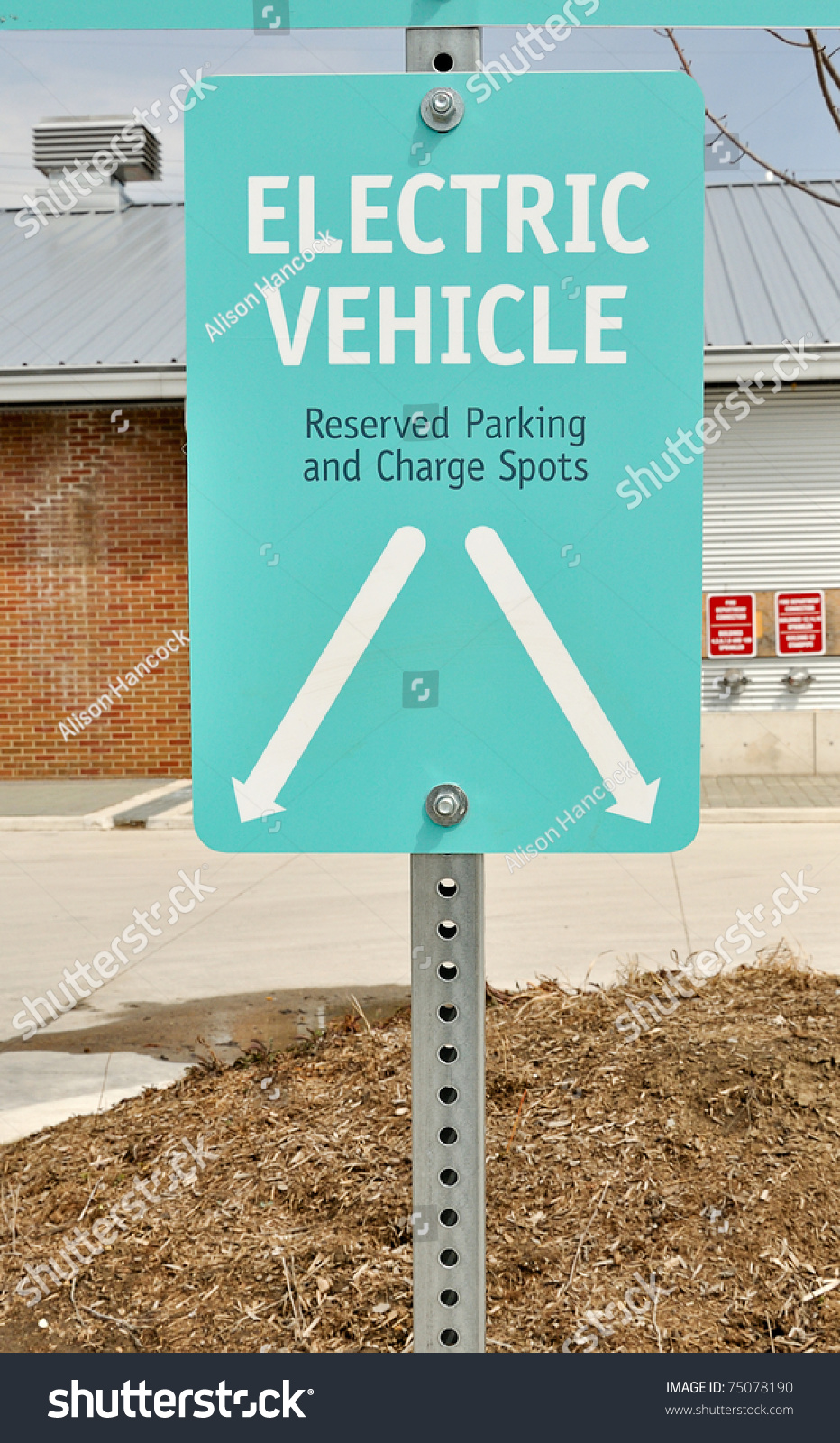 Sign For Designated Parking Spot And Charge Point For Electric Vehicle