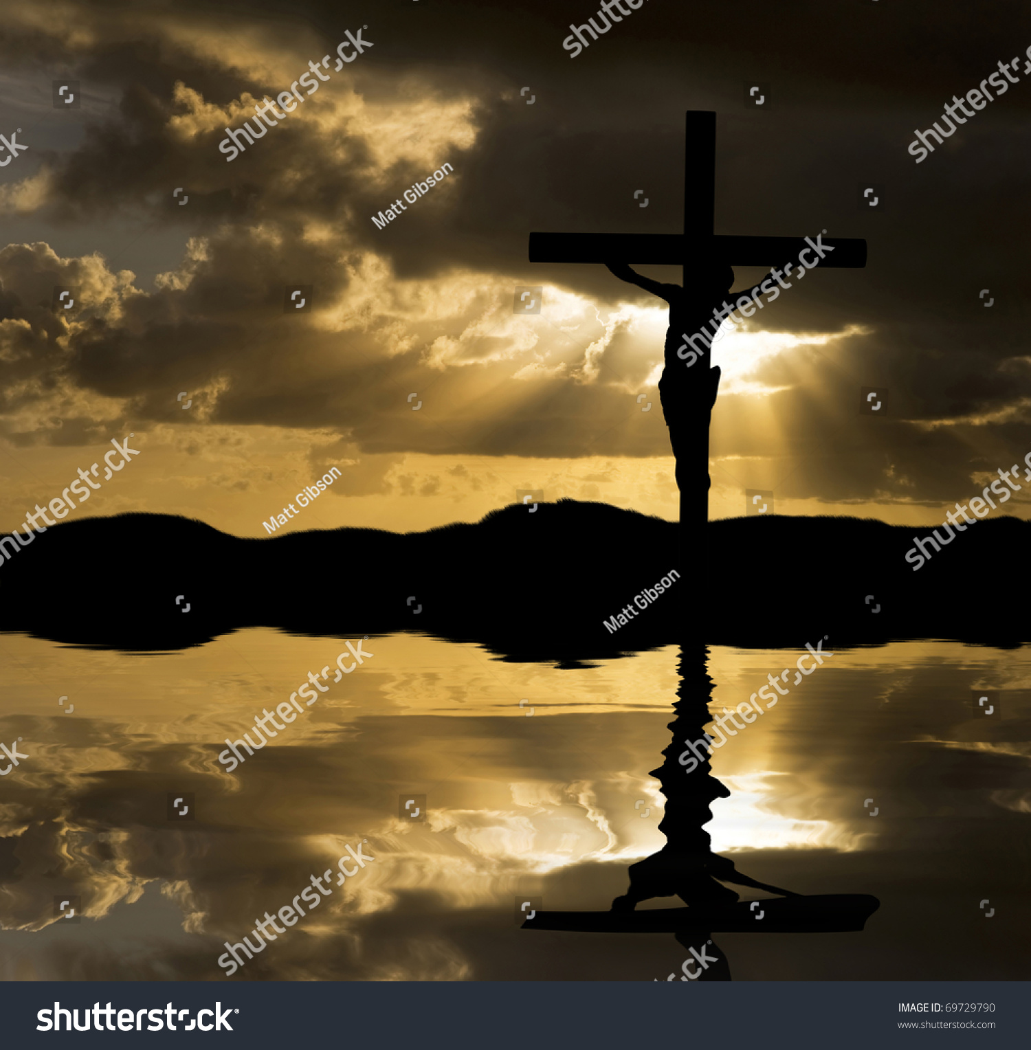 Silhouette Of Jesus Christ Crucifixion On Cross On Good Friday Easter Reflected In Lake Water