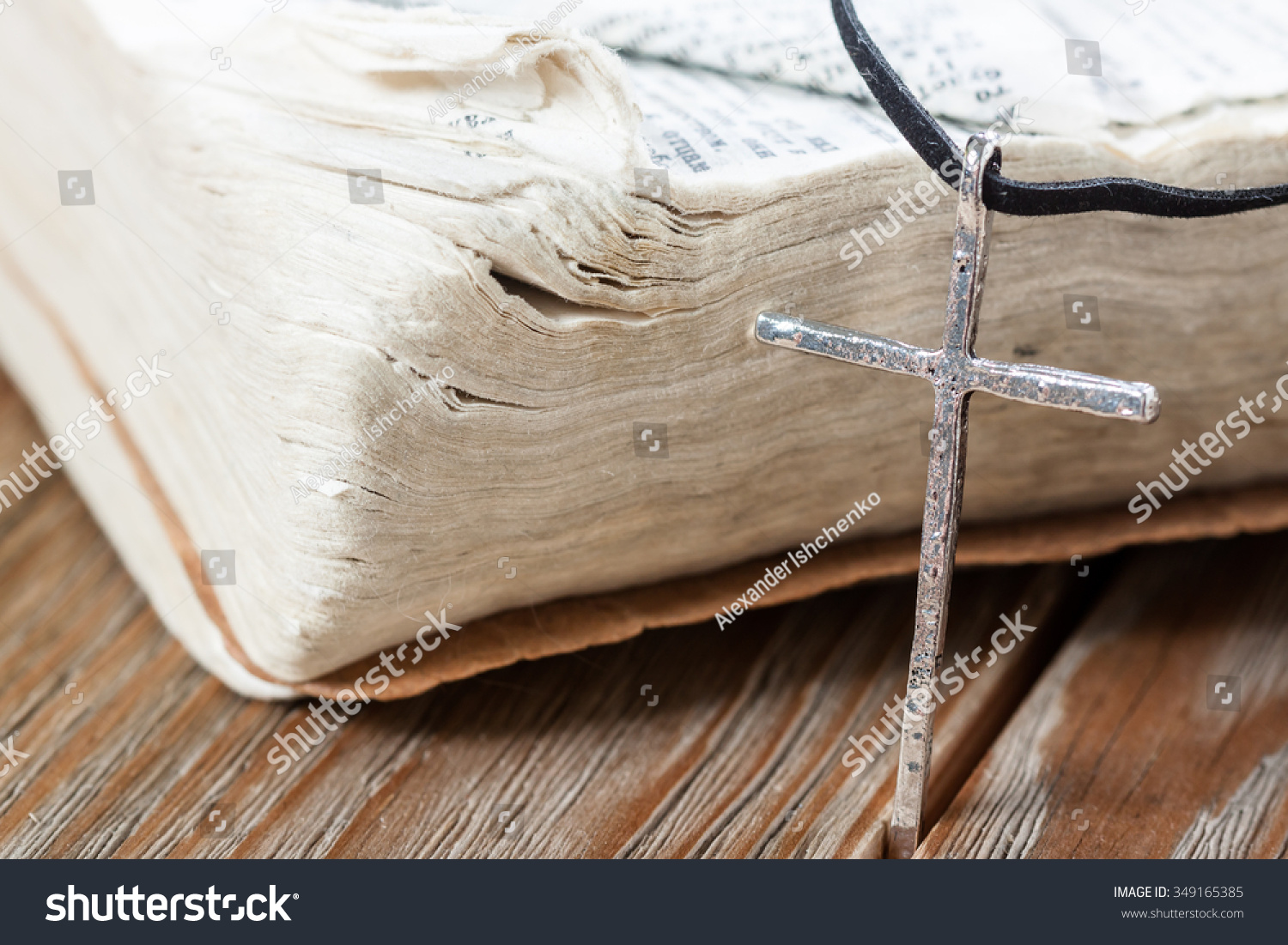 Silver christian cross on bible Religious concept Silver christian cross on bible Religious concept