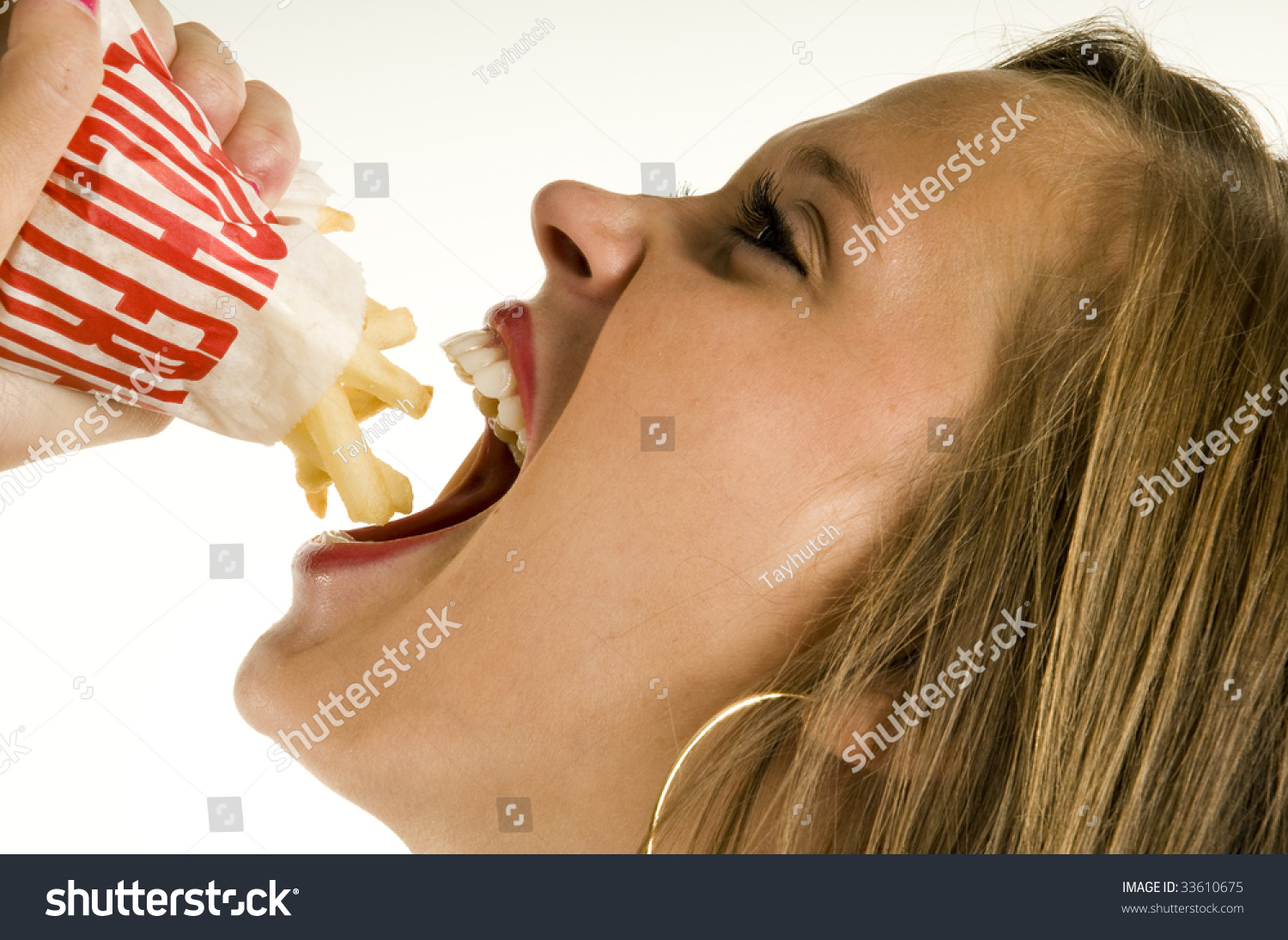 Skinny Girl Eating French Fries Stock Photo 3361067