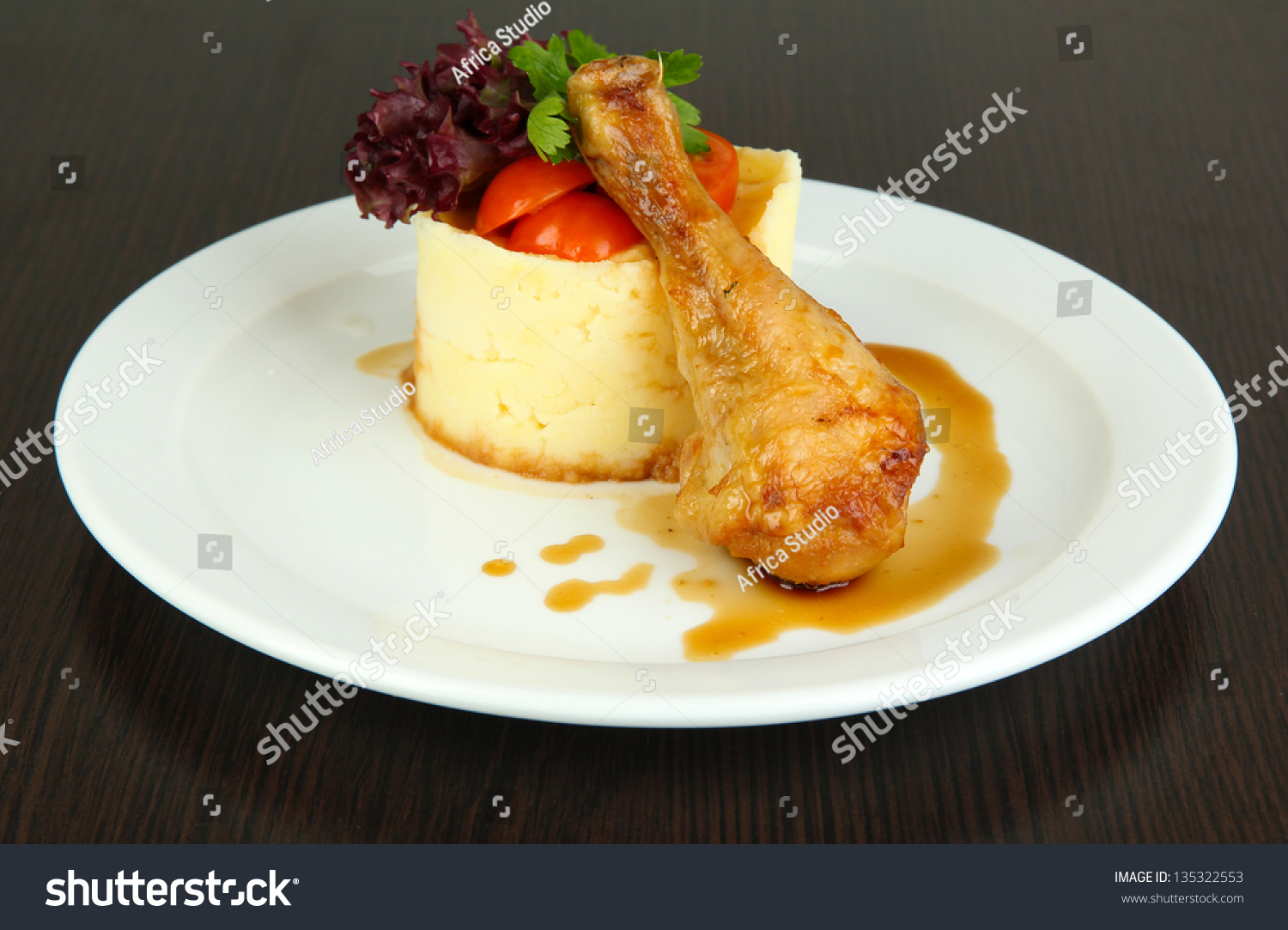 a-small-portion-of-food-on-a-large-plate-on-a-white-table-close-up