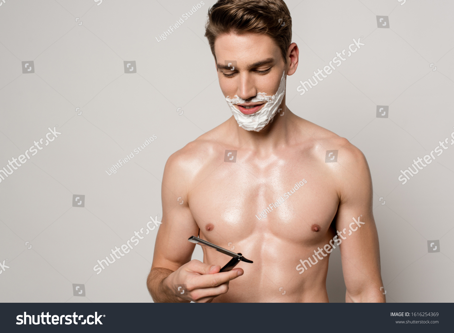 Smiling Sexy Man Muscular Torso Shaving Stock Photo