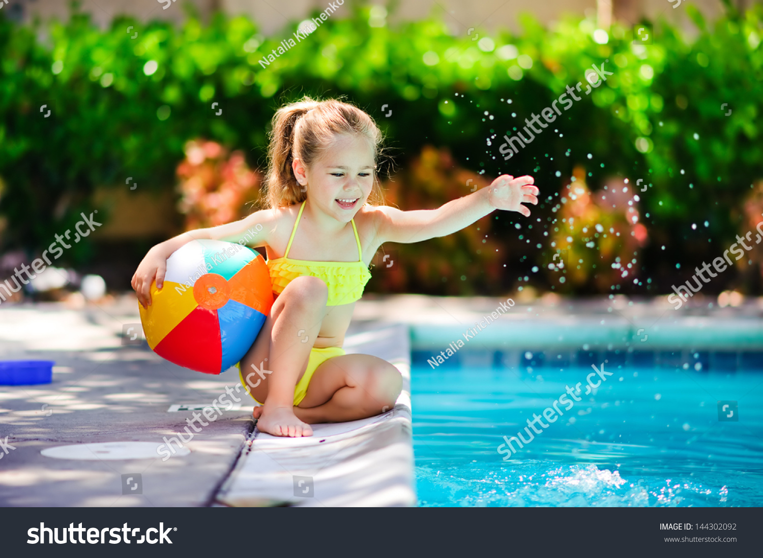 kid floating in pool