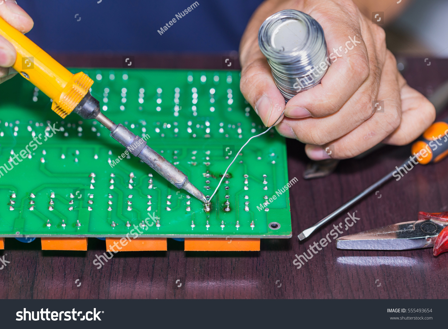 Soldering On Circuit Board Soldering Iron Stock Photo 555493654