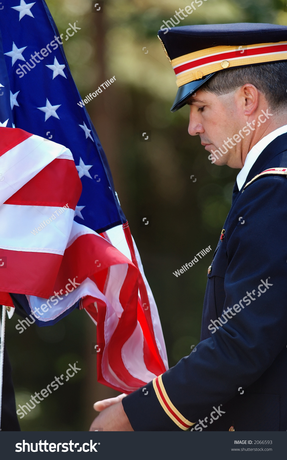 Soldier Helping Raise The American Flag Soldier Helping Raise The American Flag Stock Photo