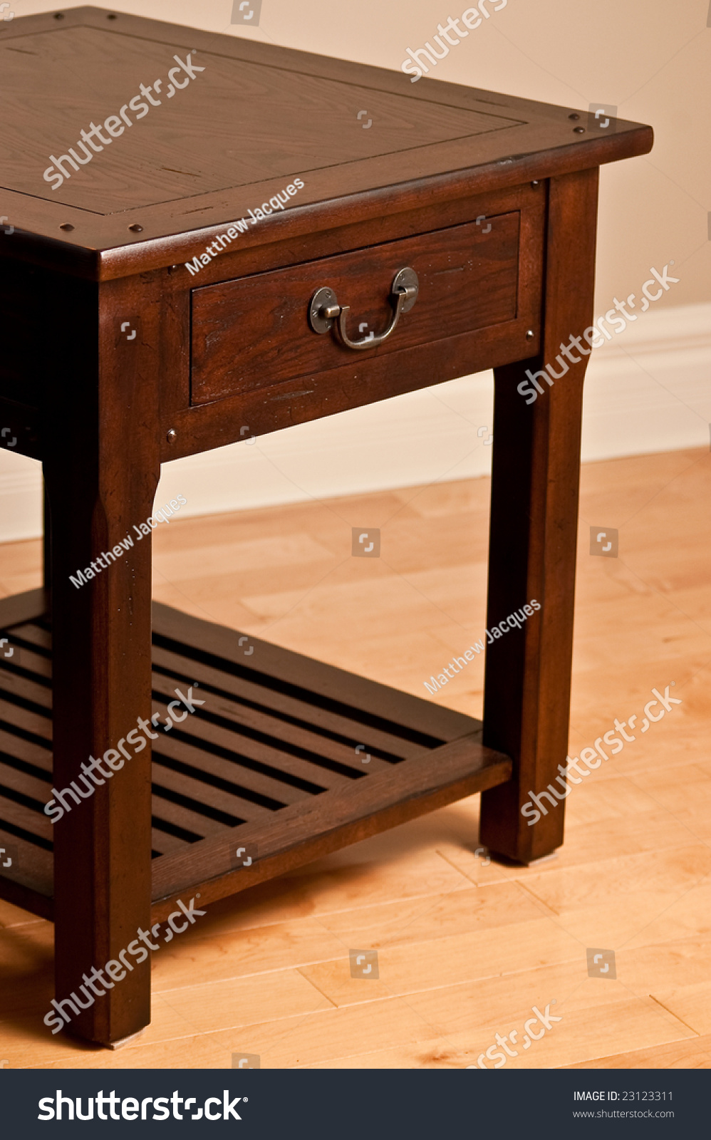 Solid Wood End Table Against Earth Tone Wall And Hardwood Floor - Solid Wood End Table Against Earth Tone Wall And Hardwood Floor Previewsave To A Lightbox solid wood end table against earth tone wall and hardwood floor - solid wood end table against earth tone wall and hardwood floor previewsave to a lightbox