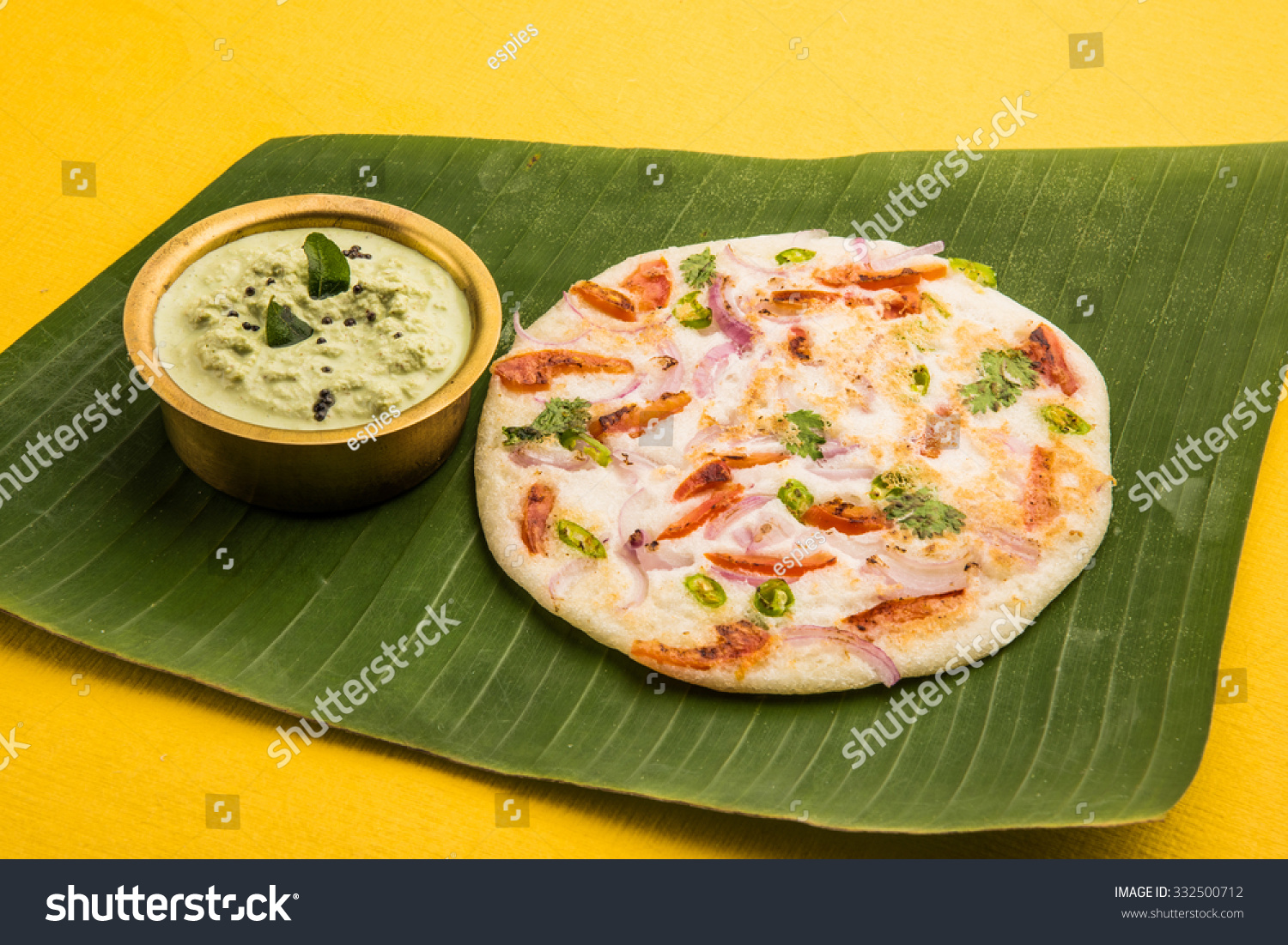 South Indian Favourite Food Uttapam, Served Over Banana Leaf With