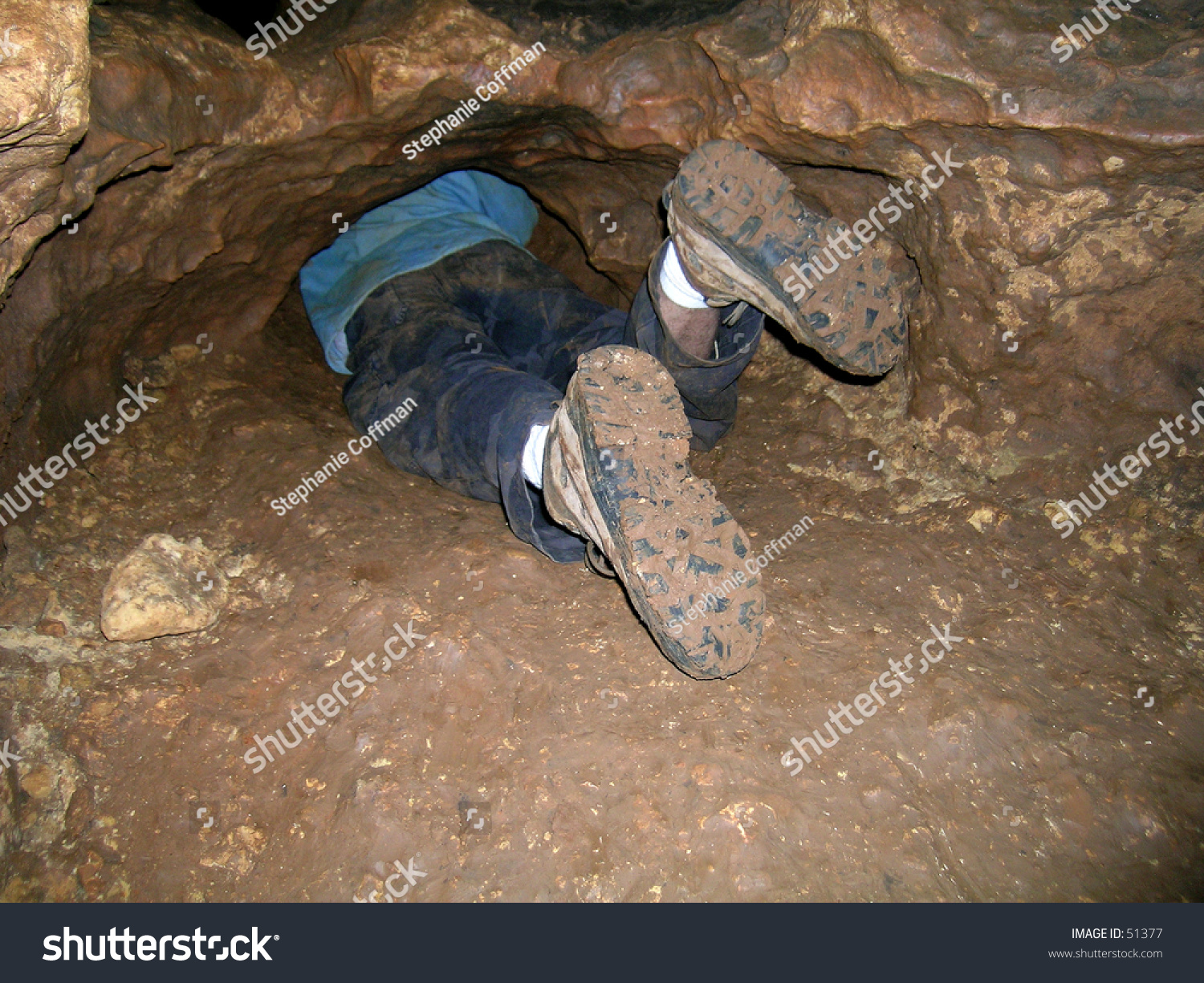 Spelunker Crawling Through Cave Stock Photo Shutterstock
