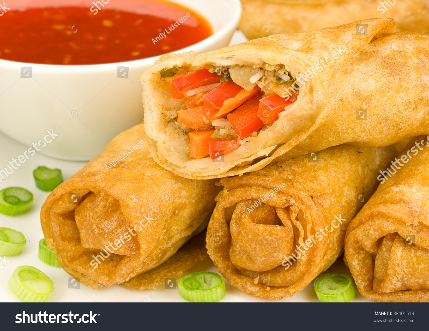 Spring Rolls With Sweet Chilli Dipping Sauce And Garnish Stock Photo
