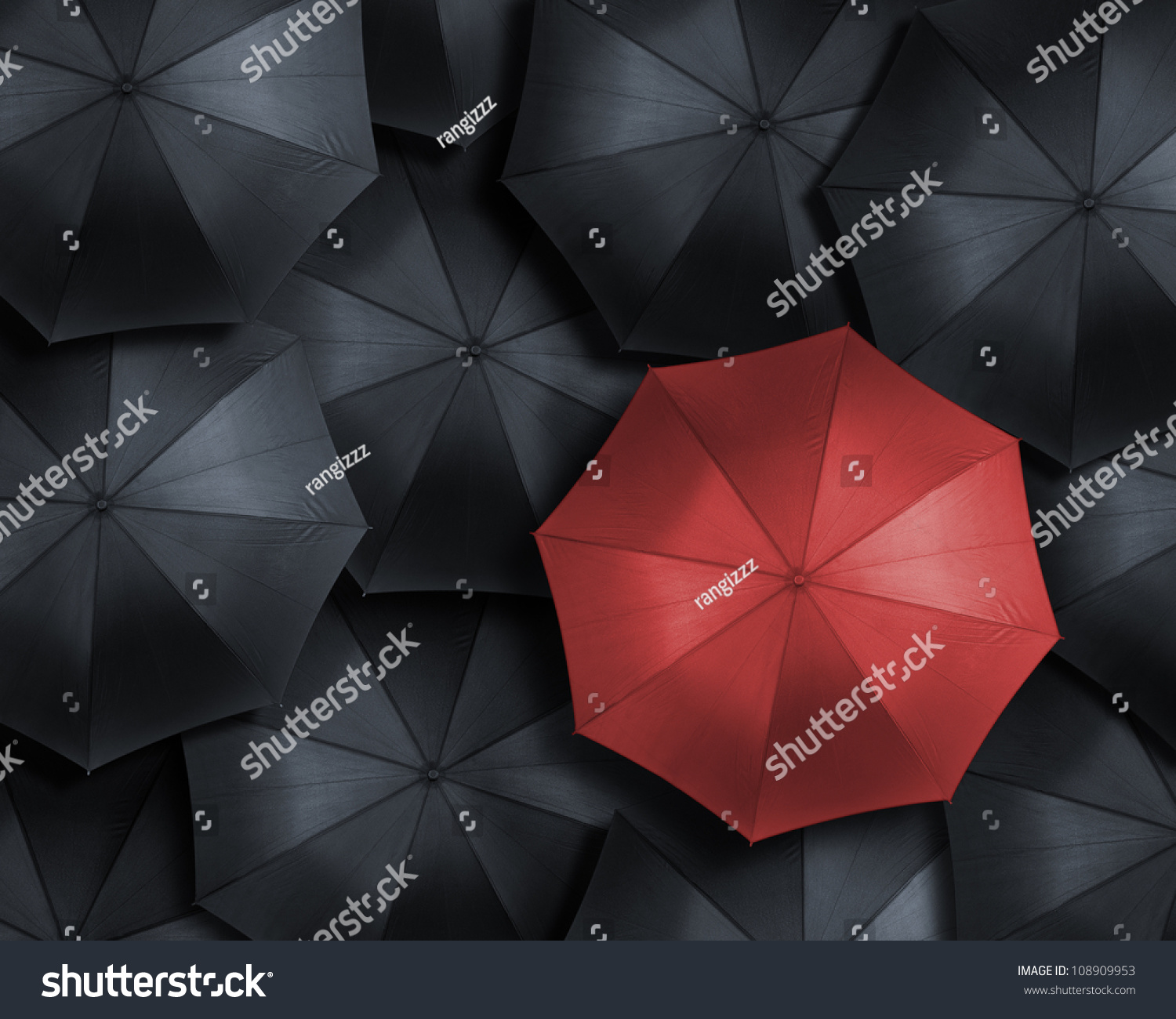 Standing Out From The Crowd, High Angle View Of Red Umbrella Over Many