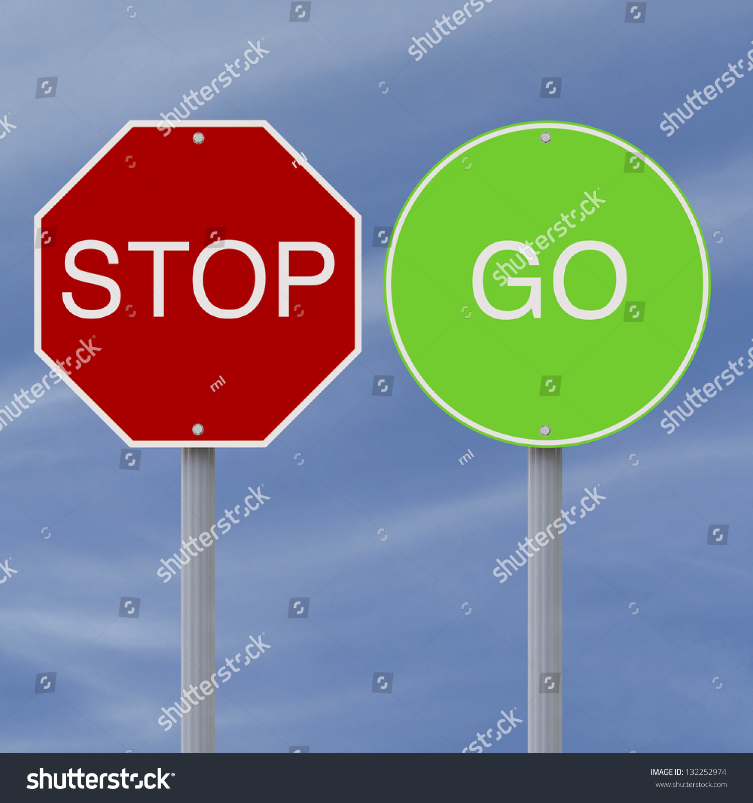 Stop And Go Signs Against A Blue Sky Background Stock Photo 132252974