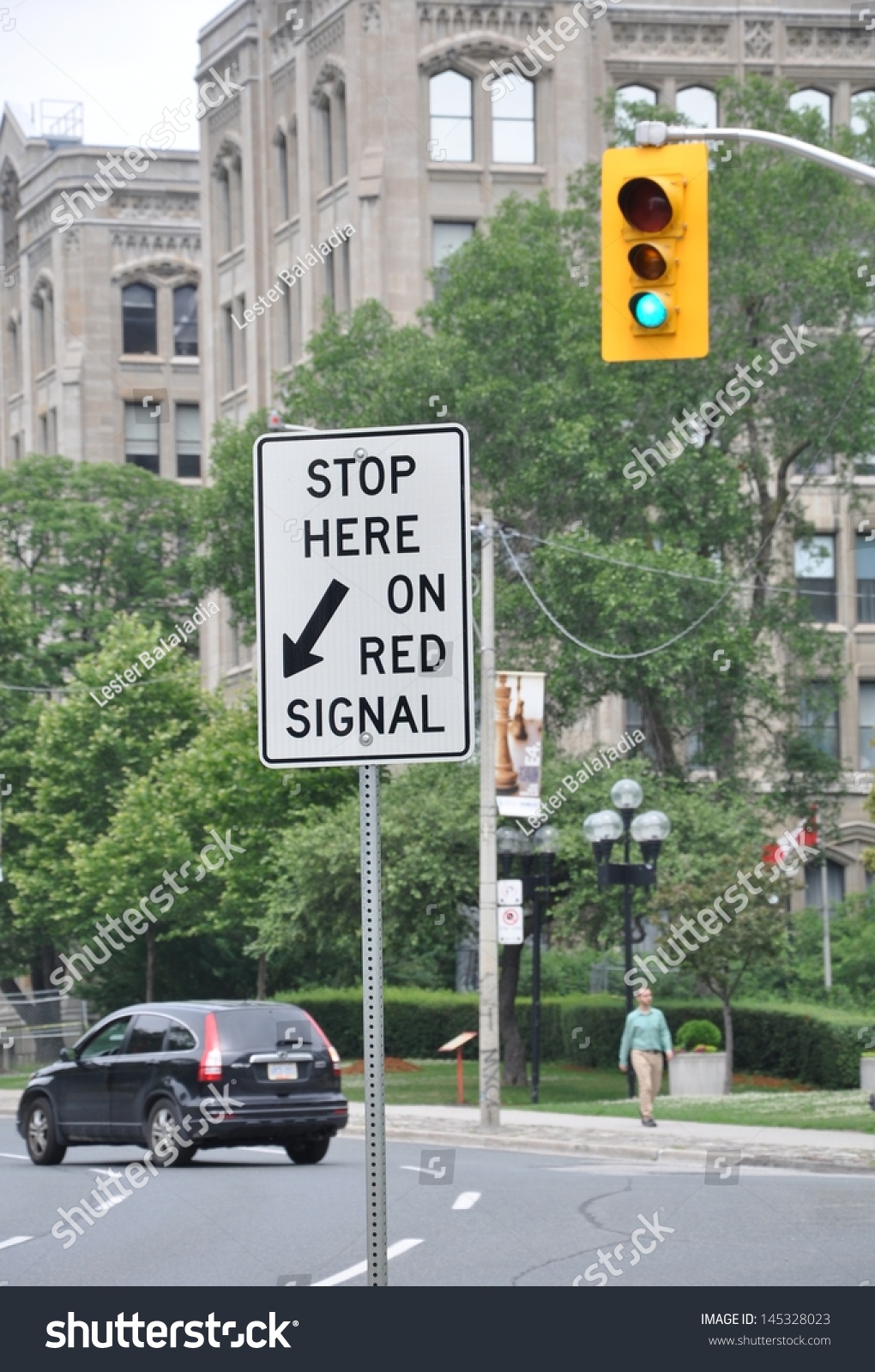 stop-here-on-red-signal-signage-stock-photo-145328023-shutterstock