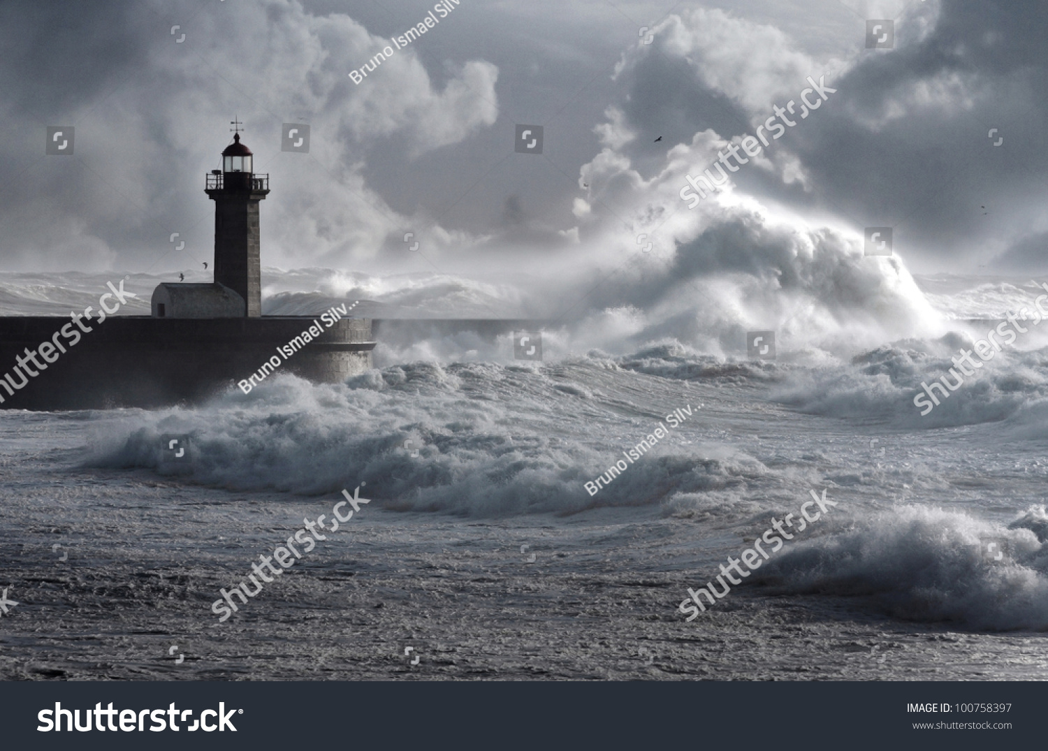 Storm Waves Over The Lighthouse, Portugal - Enhanced Sky Stock Photo