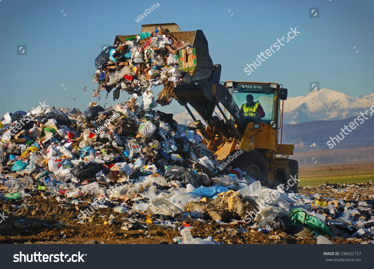 Strambino Italy January 29 2014 Caterpillar compactor working in a landfill Strambino Italy January 29 2014 Caterpillar compactor working in a landfill