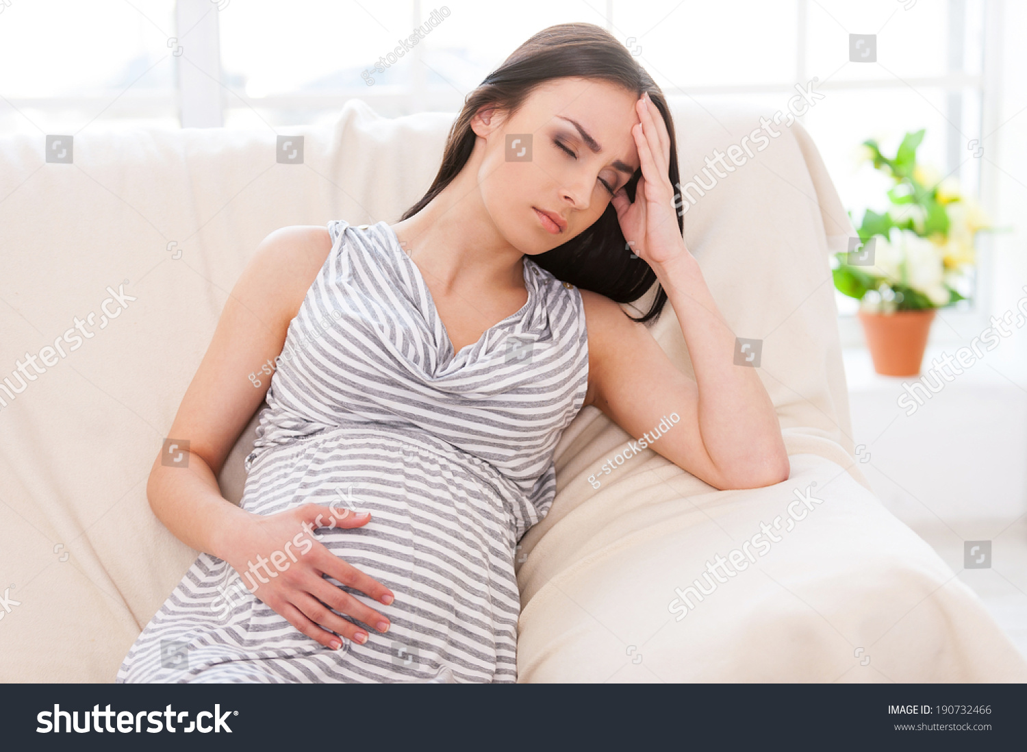 Struggling With Morning Sickness Depressed Pregnant Woman Holding Hand