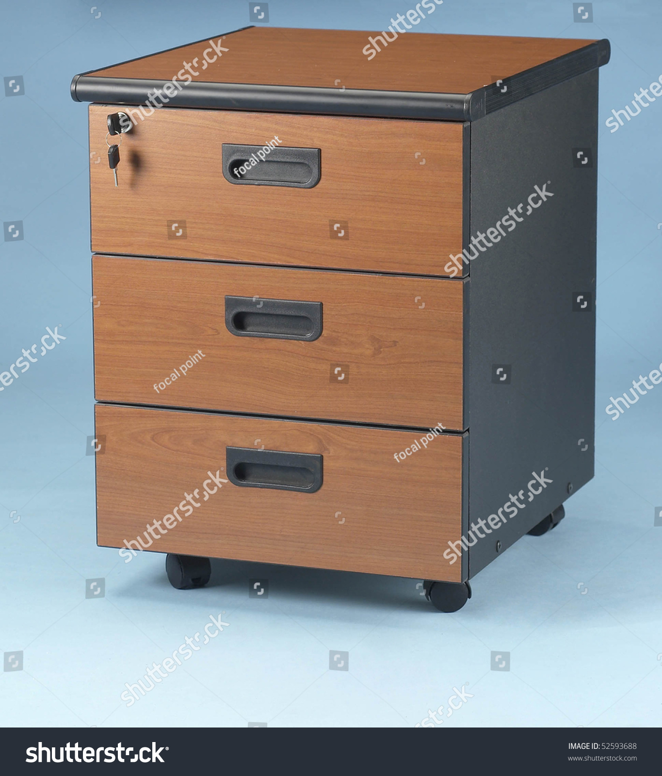 Studio Shot Of Lockable Drawer With Keys Hanging. Stock Photo 52593688