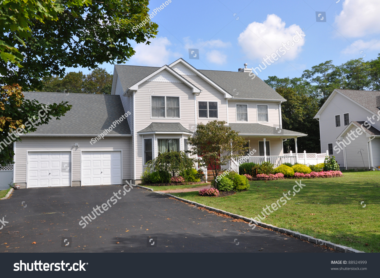 Suburban Two Car Garage Large Siding Home With Double Wide ...