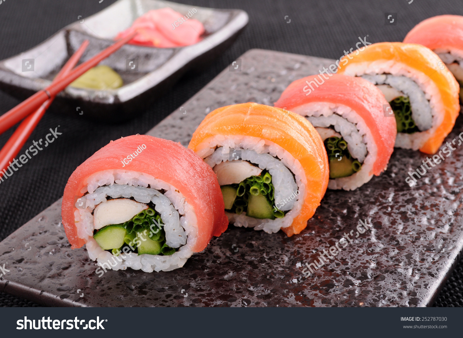 Sushi Roll : Row Of Salmon & Tuna Sushi Rolls With Chopsticks Stock 