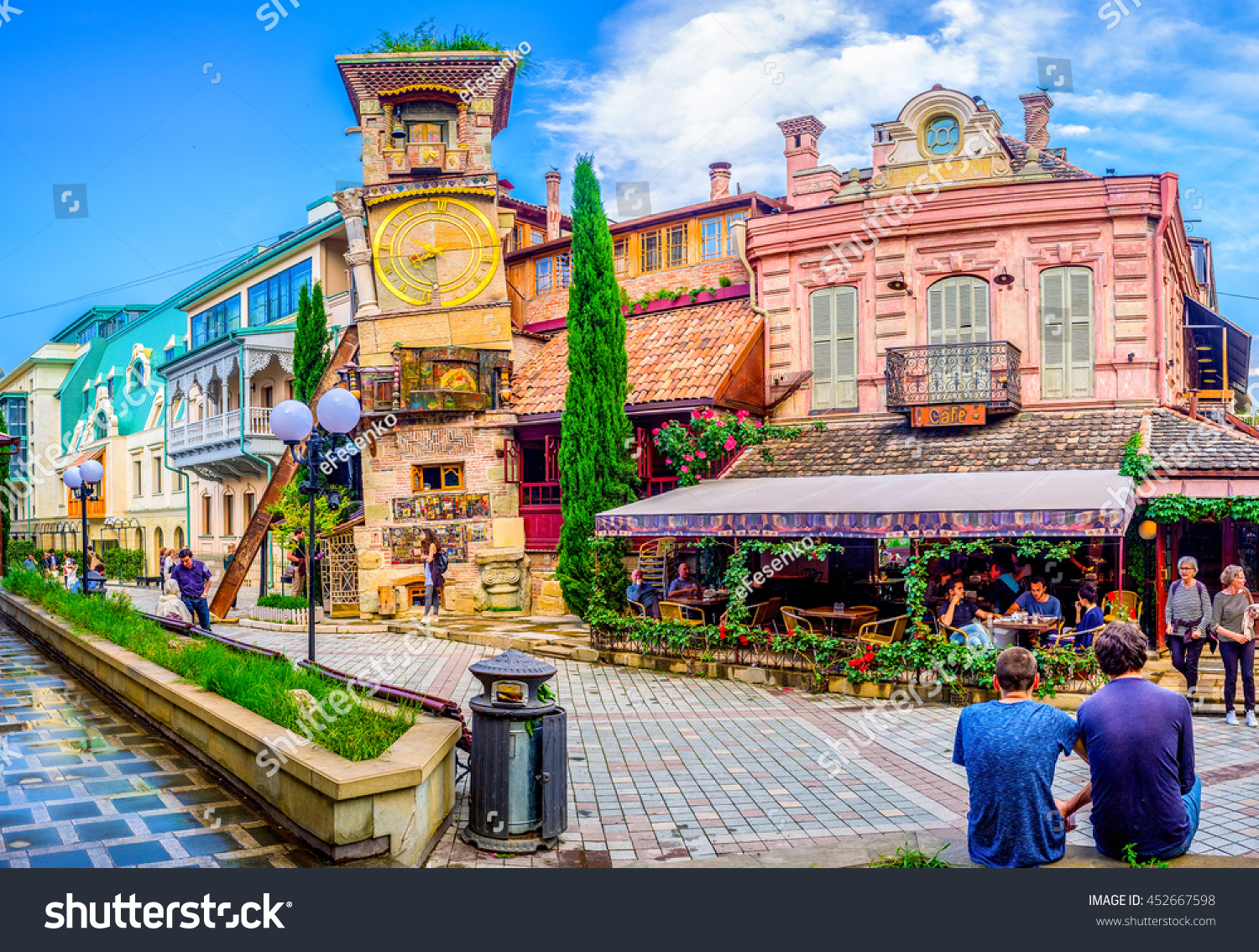TBILISI GEORGIA MAY 28 2016 The leaning clock tower of Rezo Gabriadze Puppet Theatre with the art cafe from the right on May 28 in Tbilisi TBILISI GEORGIA MAY 28 2016 The leaning clock tower of Rezo Gabriadze Puppet Theatre with the art cafe from the right on May 28 in Tbilisi