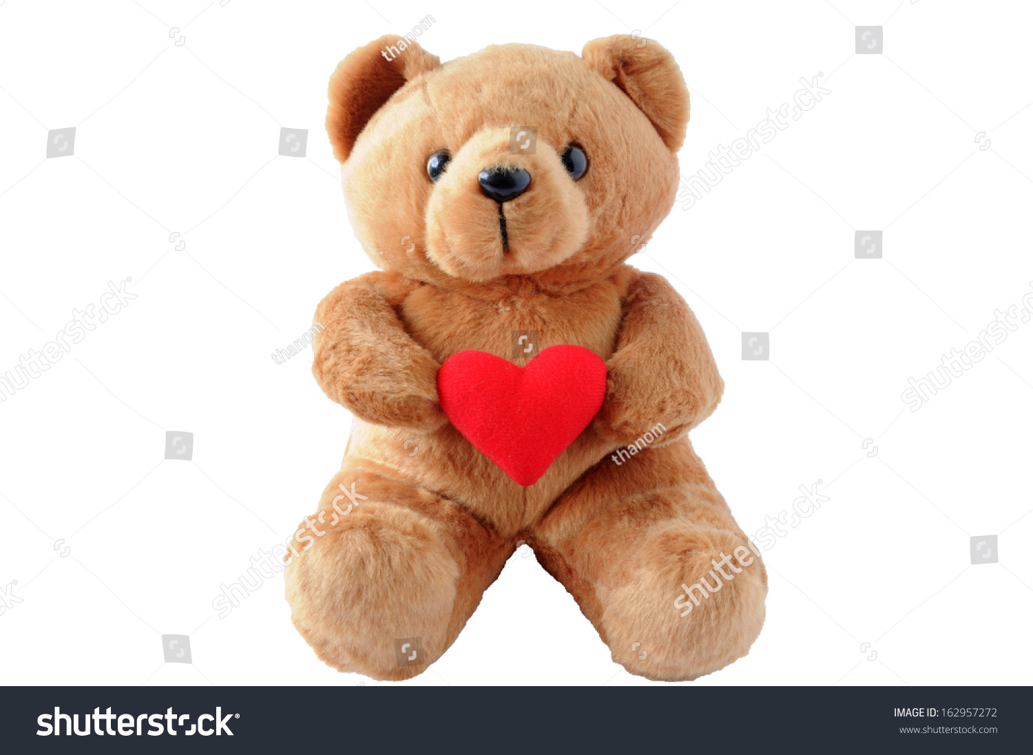 stuffed bear holding a heart