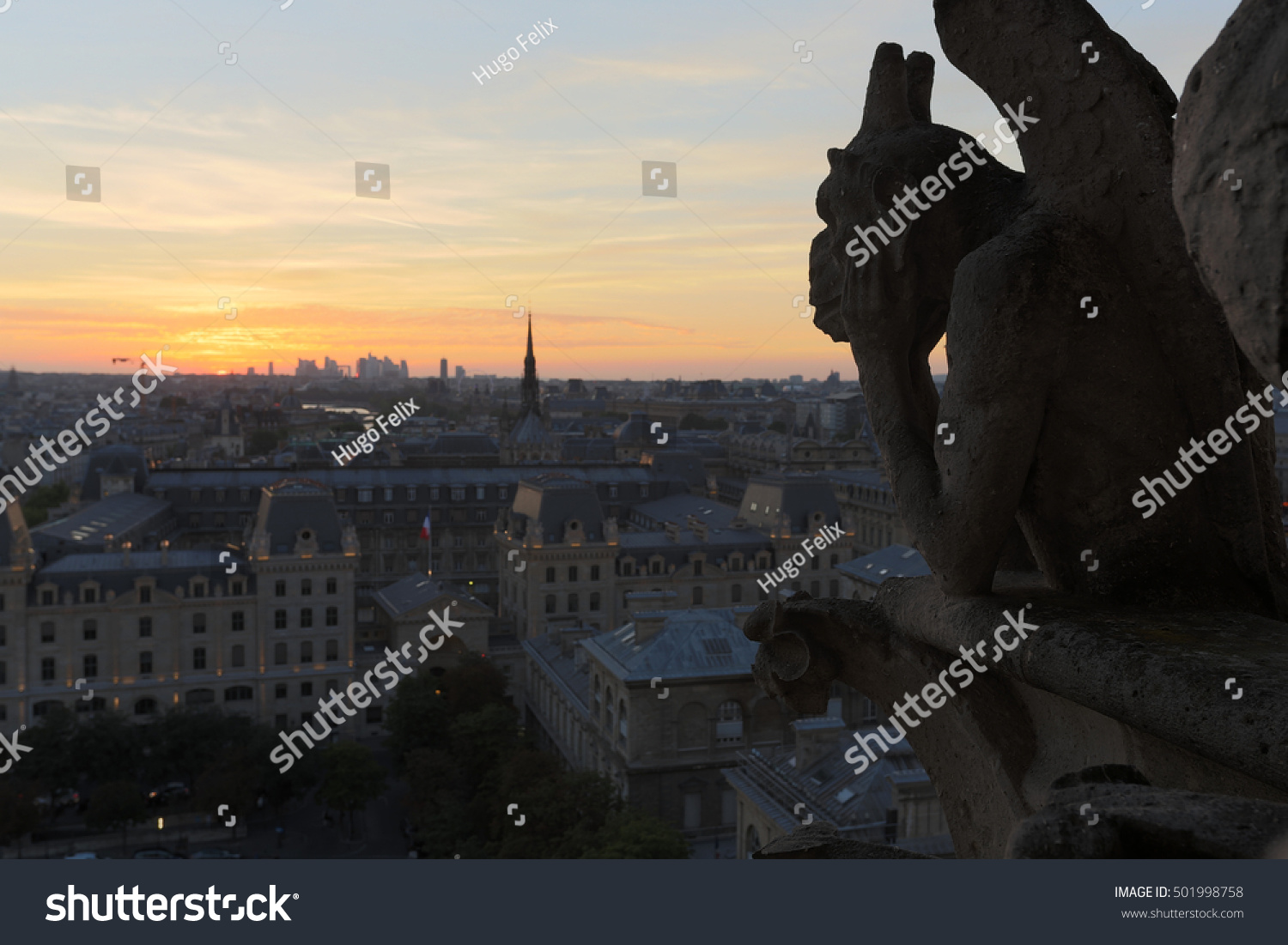 The Chimeras of Notre Dame watching the sunset in Paris The Chimeras of Notre Dame watching the sunset in Paris