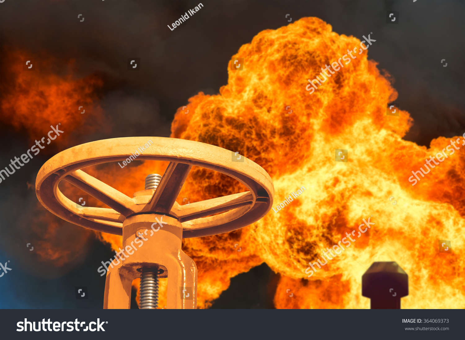 The gas valve on the background of flaming torch flame The gas valve on the background of flaming torch flame
