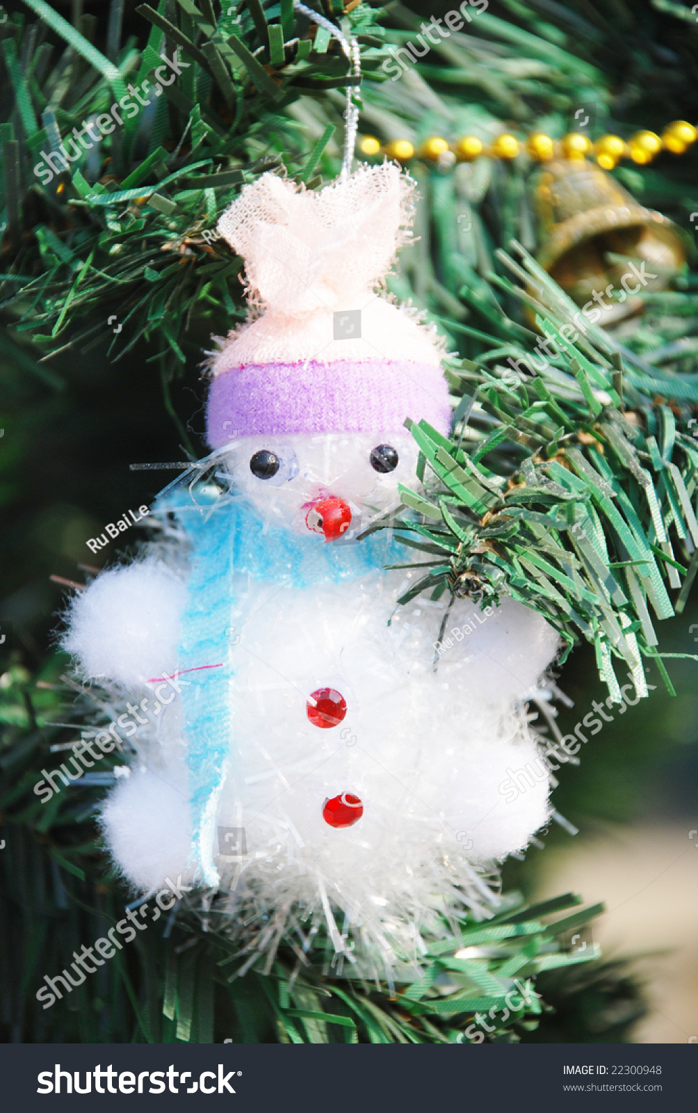 The Merry Christmas Decoration Snowman On Fir Tree. Stock Photo