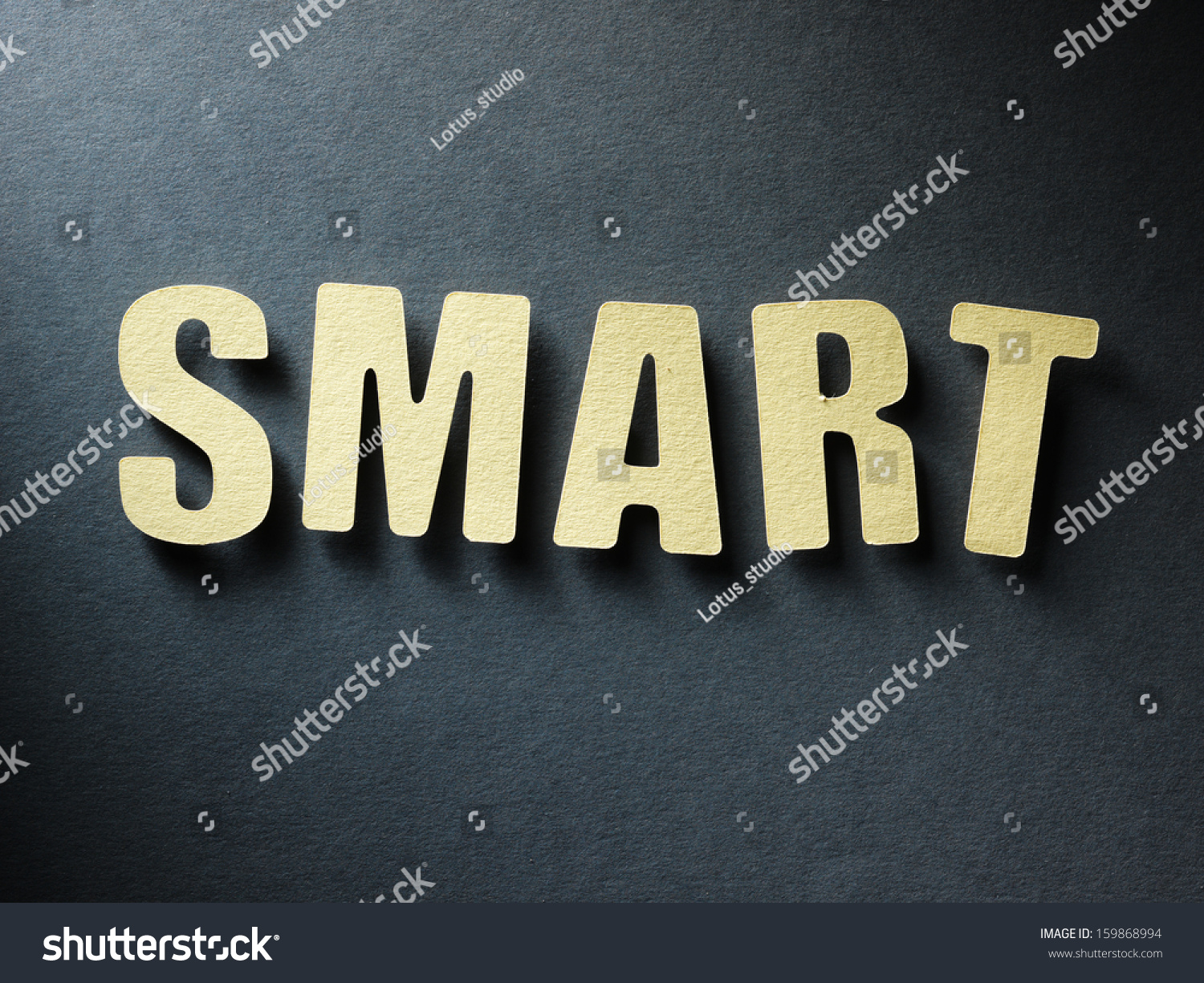 the-word-smart-in-cut-out-paper-letters-on-paper-background-stock-photo