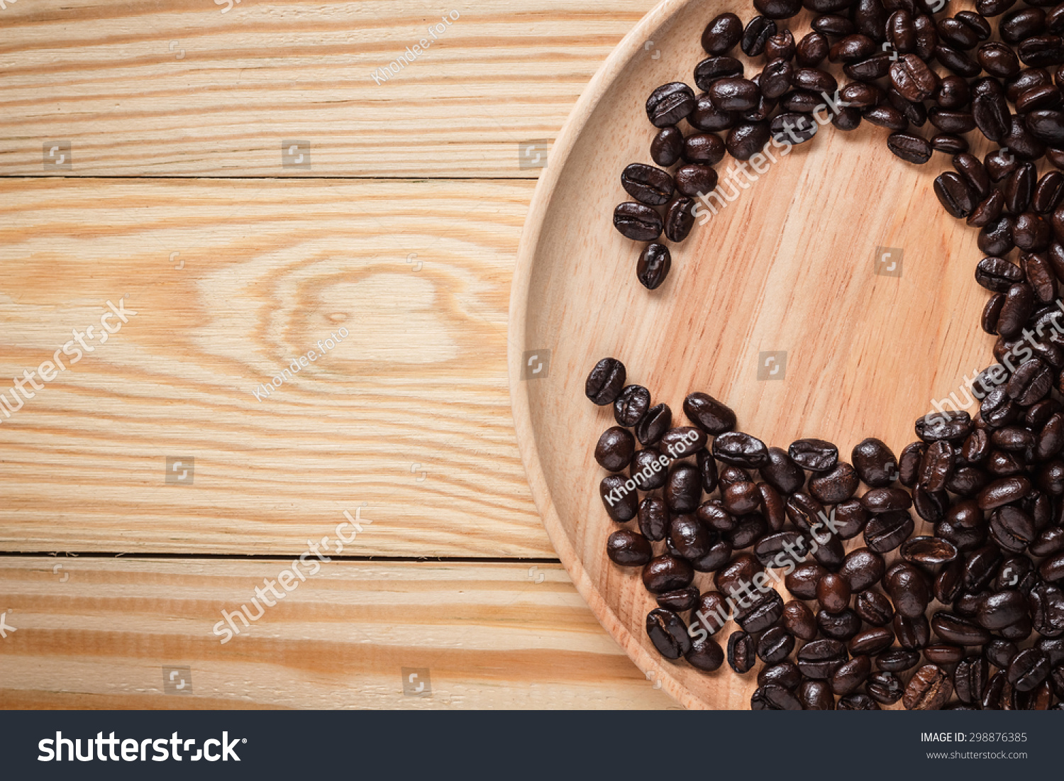 Top view Coffee bean were placed on a wooden plate Top view Coffee bean were placed on a wooden plate