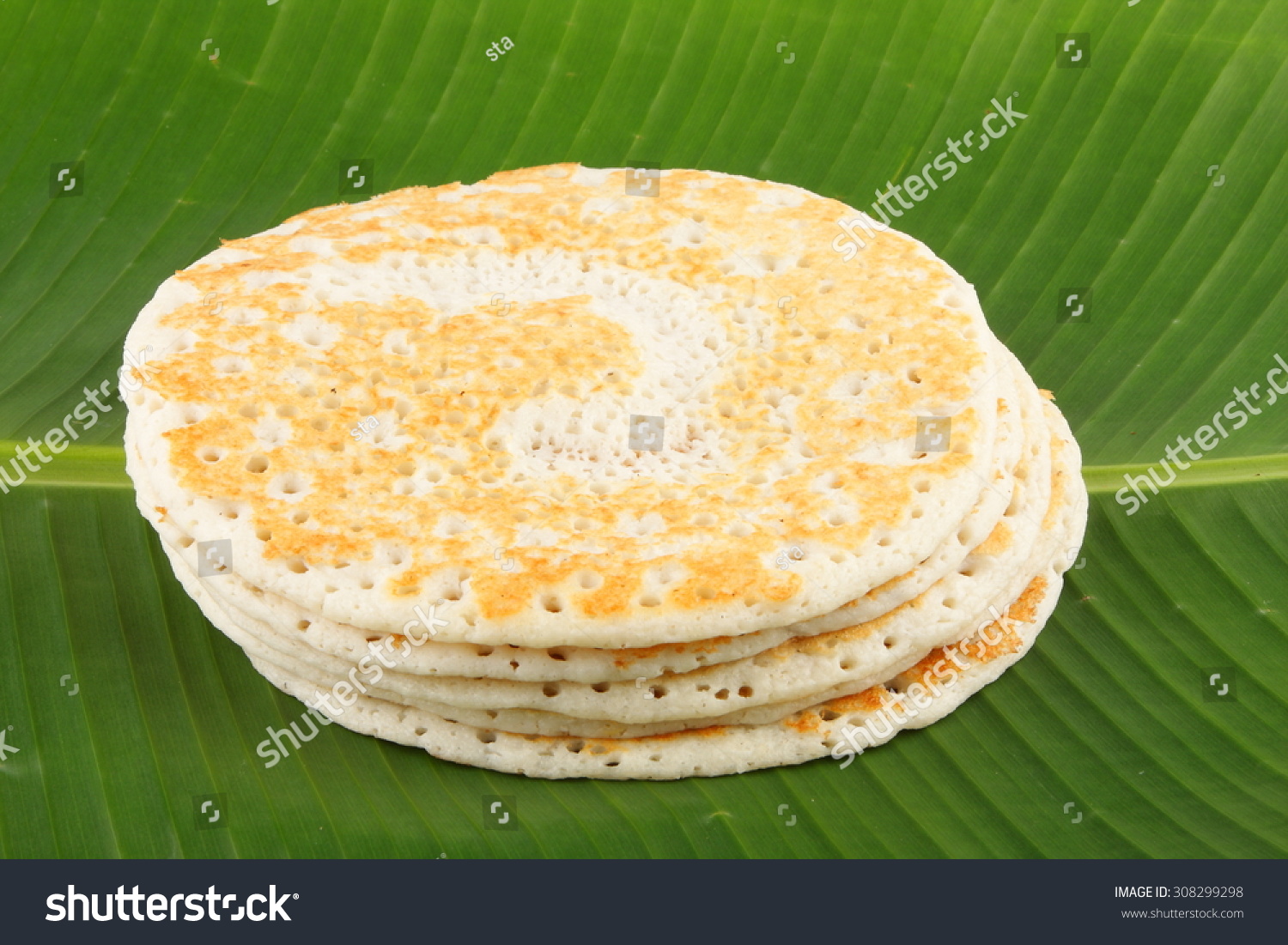 Traditional South Indian breakfast Dosa served on banana leaf Traditional South Indian breakfast Dosa served on banana leaf