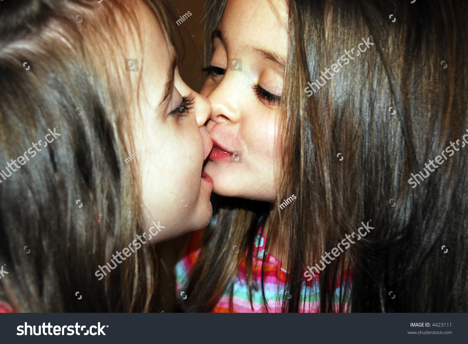 Twins kissing each other