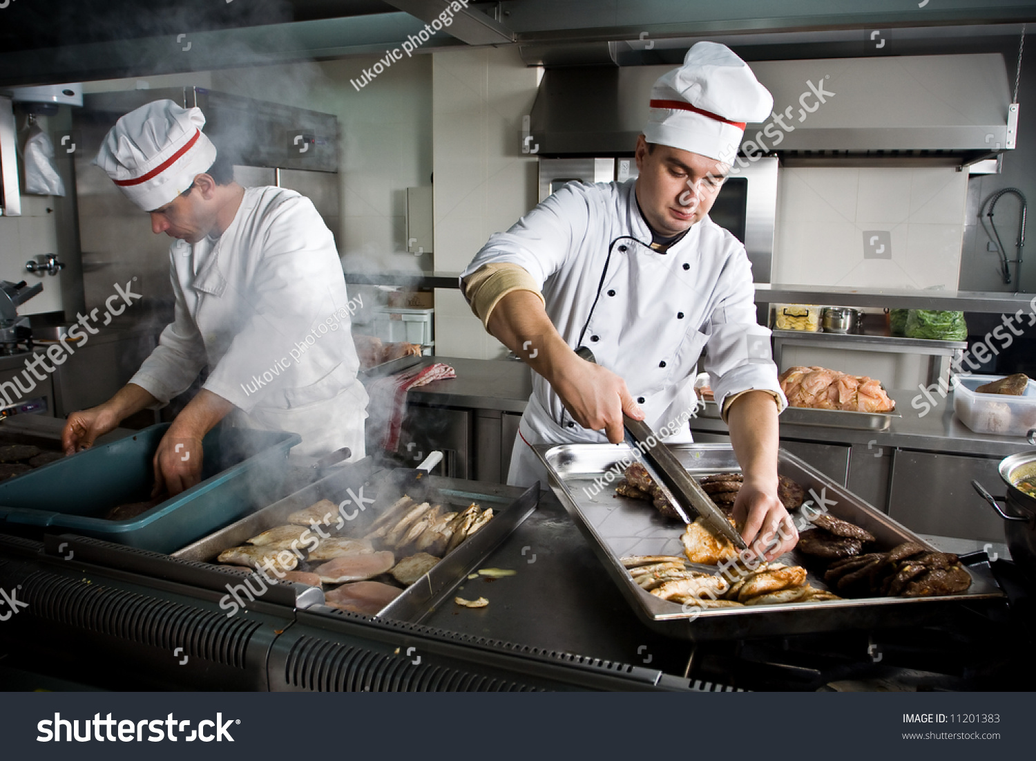 Two Chefs At Work In A Restaurant Stock Photo 11201383 : Shutterstock