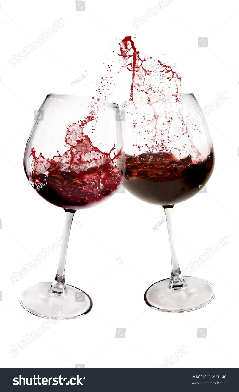 Two Glasses Of Red Wine Toasting On White Background Stock Photo