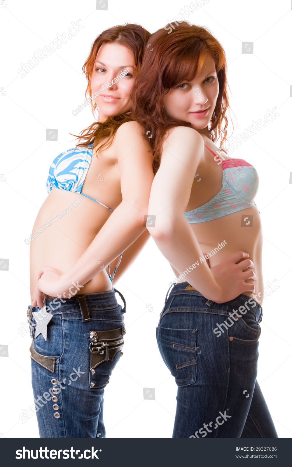 Two Red Girls In Bikini And Jeans Isolated On A White Background Stock