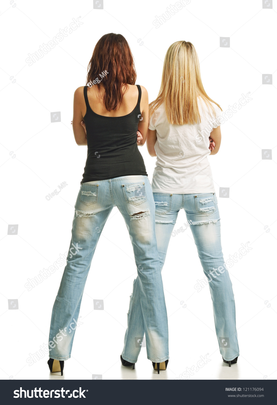stock-photo-two-young-women-are-standing-back-their-legs-are-planted-apart-on-high-heels-they-are-wearing-121176094.jpg