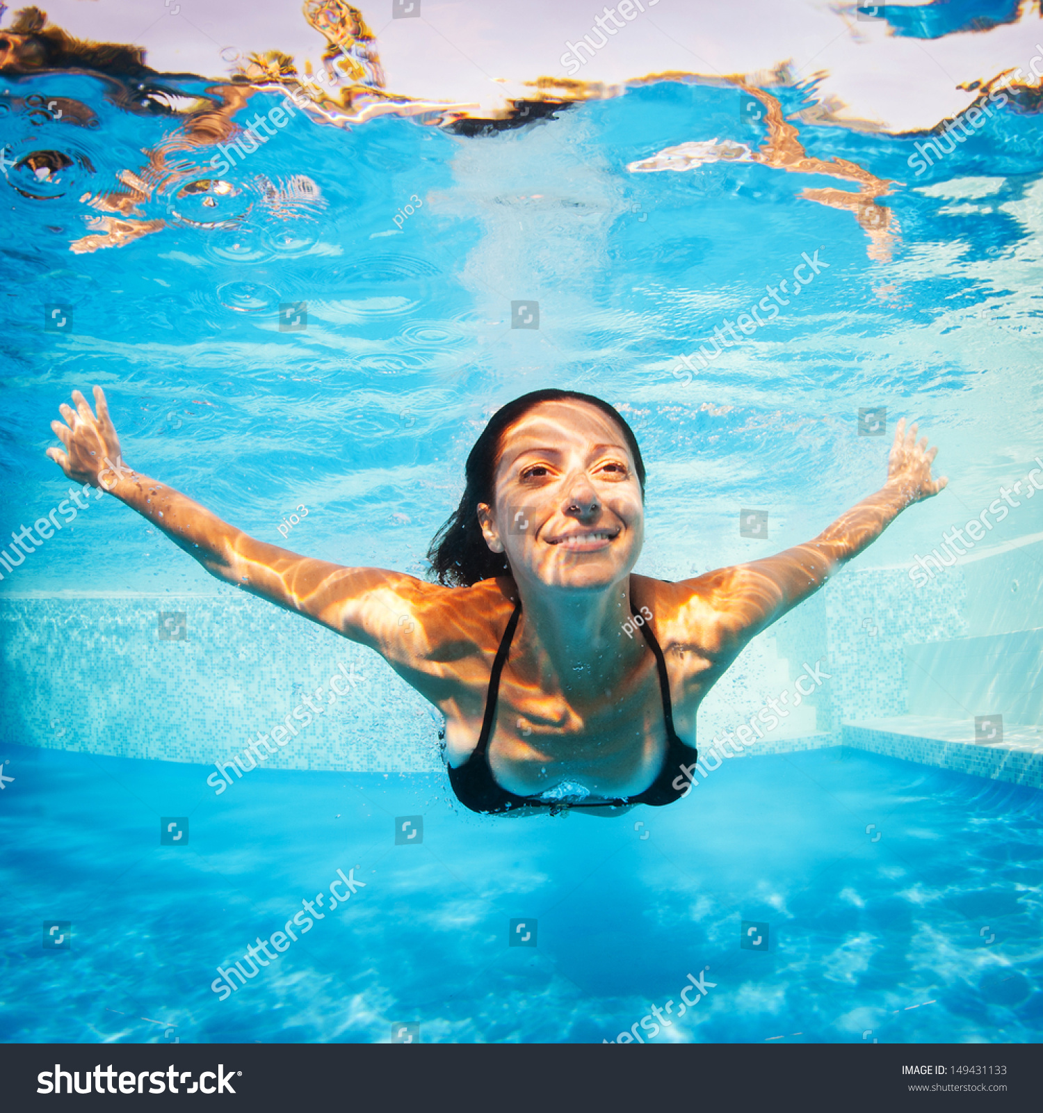 Underwater Woman Portrait Wearing Black Bikini In Swimming Pool Stock