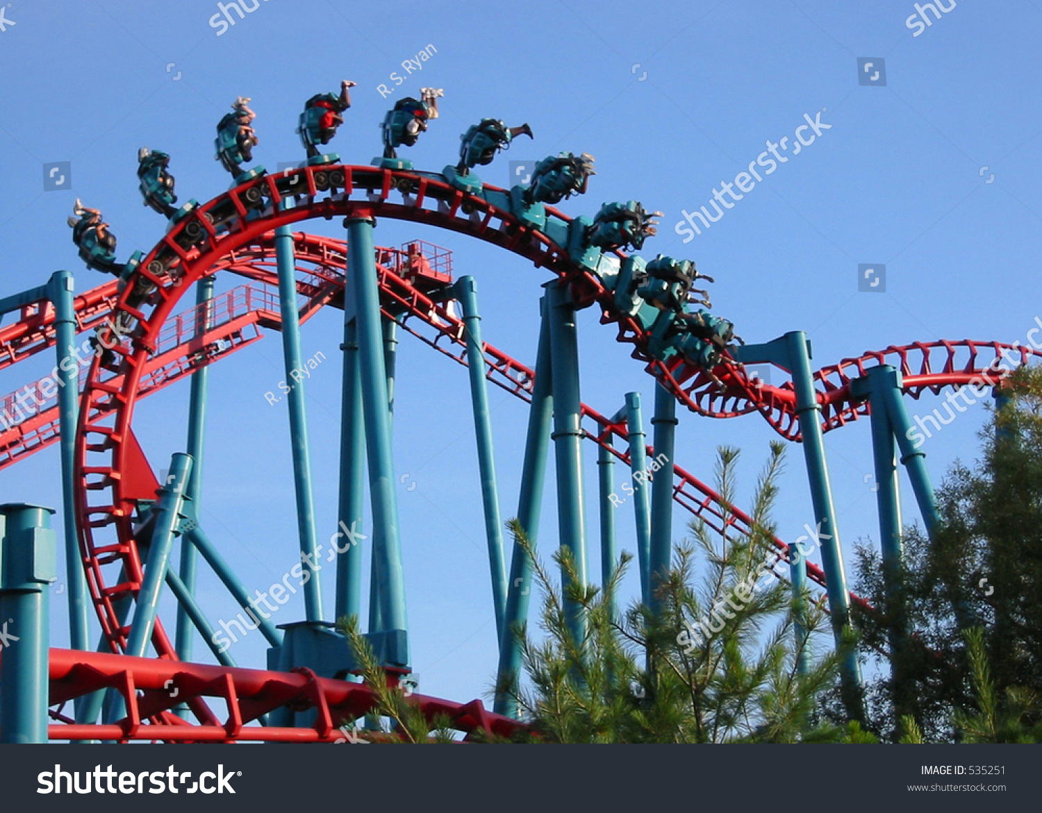 Upside Down Riders On A Suspended Rollercoaster Denoting Speed - Slight 