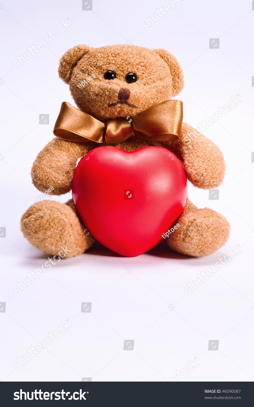 teddy holding a heart