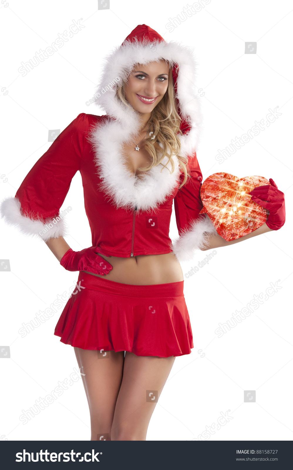 Very Sexy And Attractive Smiling Blond Girl In Red Santa Claus Costume Keeping A T Box Over