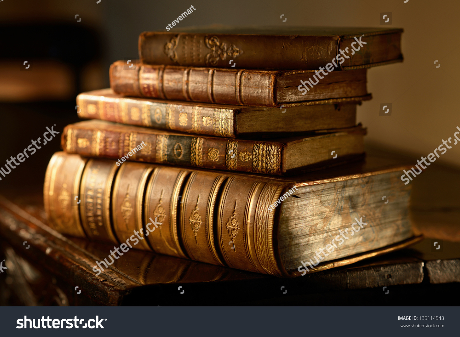 Vintage, Antiquarian Books Pile On Wooden Surface In Warm Directional ...