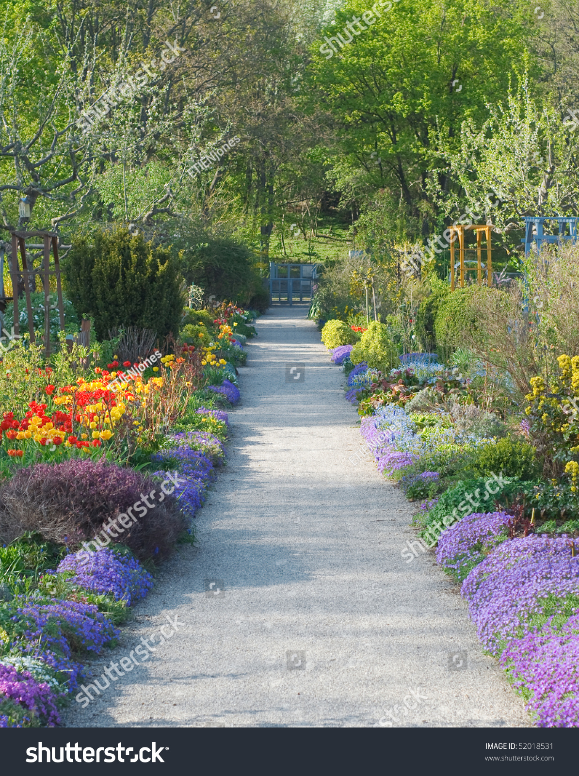 Walkway Through Peaceful Spring Scenery With Blossoms Stock Photo