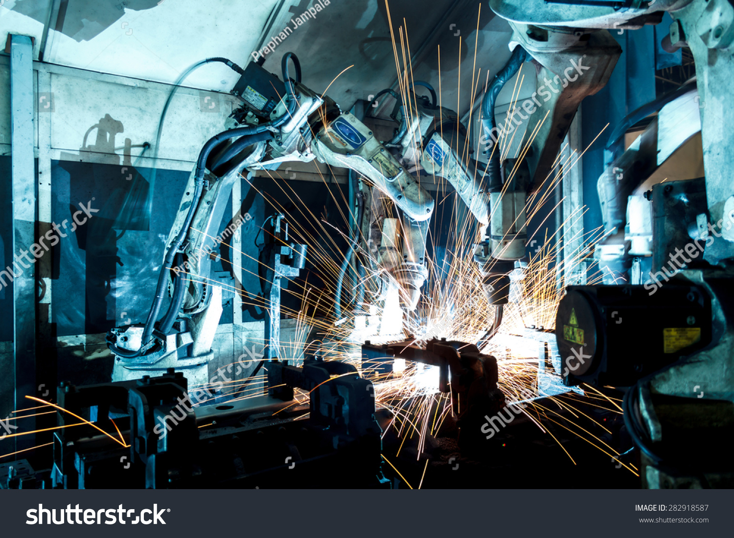 Welding Robots Movement In A Car Factory Stock Photo 282918587 ...